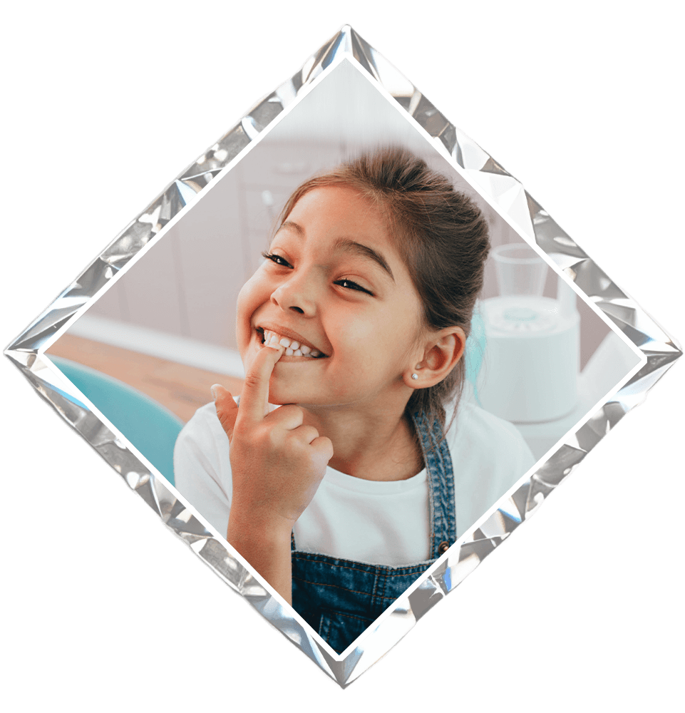 child showing off her teeth after dentist visit